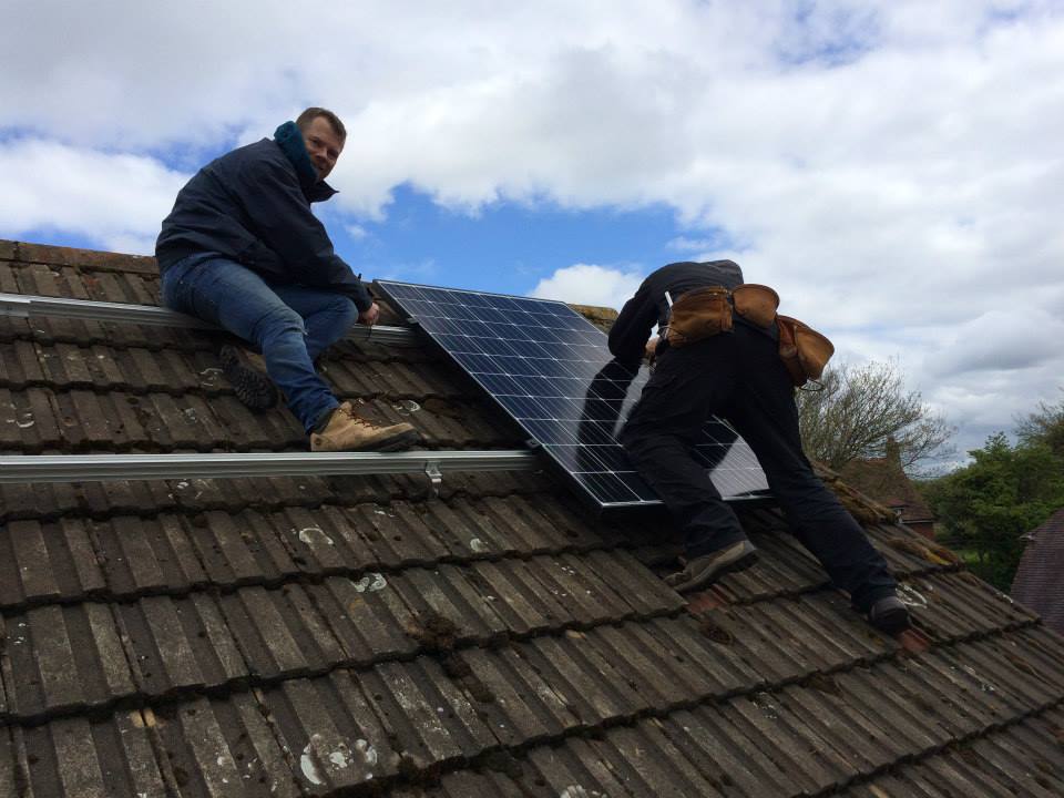 Danny fitting first panel on the roof in 2015 | Solar Panel Installation | The Green Way Solar